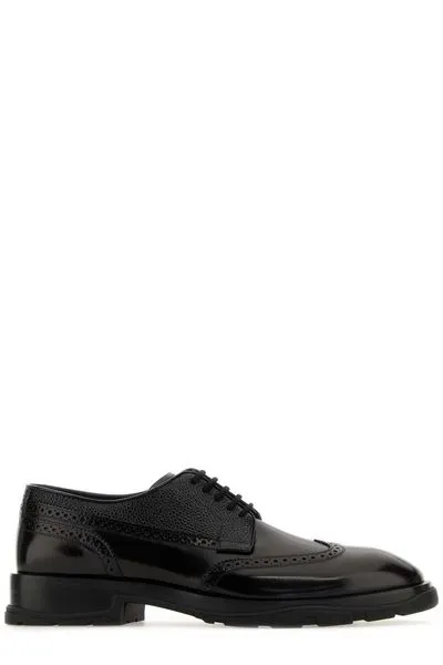 ALEXANDER MCQUEEN Black Leather Lace-Up Shoes for Men with English Perforations, Round Toe, and Rubber Sole